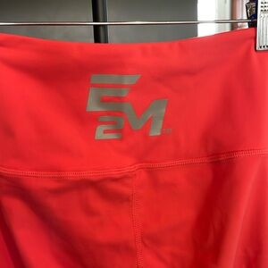 E2M salmon pink leggings with logo and mesh detail